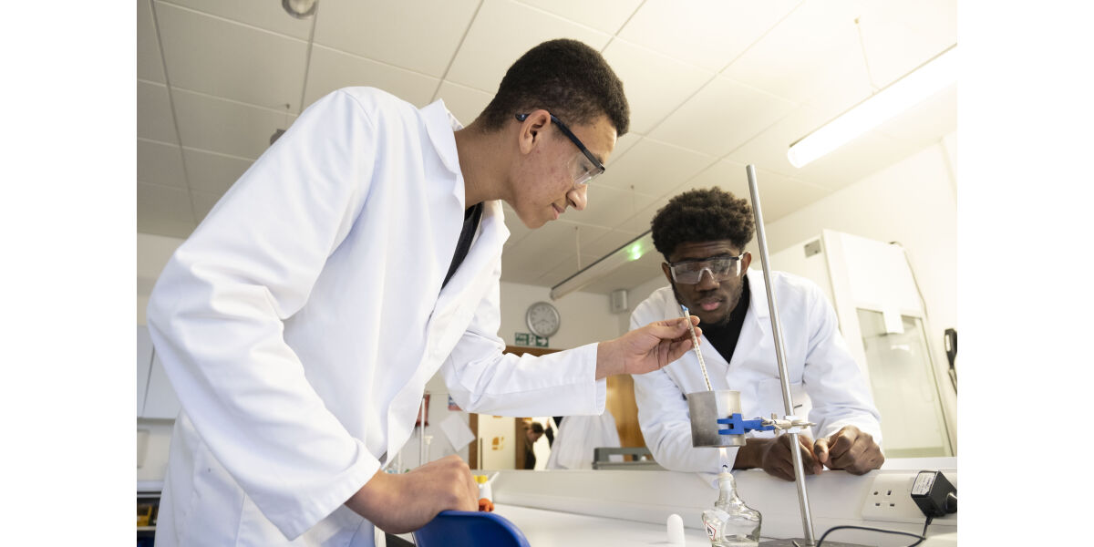Two science students undertaking an experiment in the science lab.
